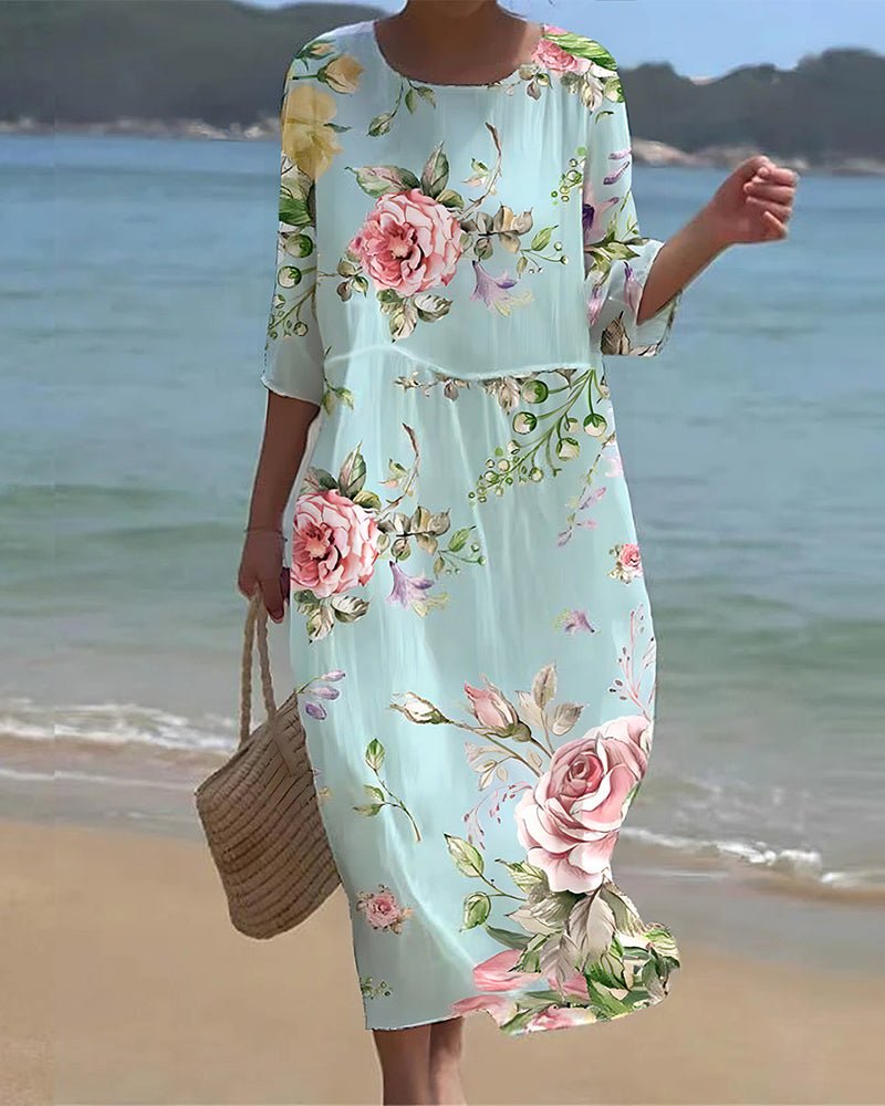 Sunset Flower Dress by THE WHITMORE FAMILY featuring blue floral pattern, lightweight fabric, and feminine design.