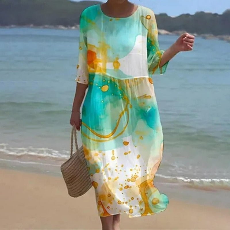 Sunset Flower Dress by THE WHITMORE FAMILY featuring blue floral pattern, flowing fabric, and sleeveless design.