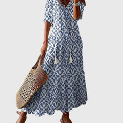 Blue Amalia boho vintage summer maxi dress by THE WHITMORE FAMILY, flowing fabric with floral patterns and relaxed style.