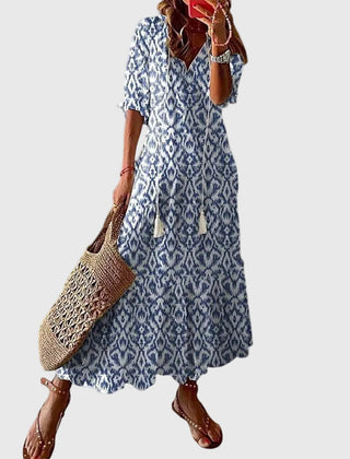 Blue Amalia boho vintage summer maxi dress by THE WHITMORE FAMILY, flowing fabric with floral patterns and relaxed style.