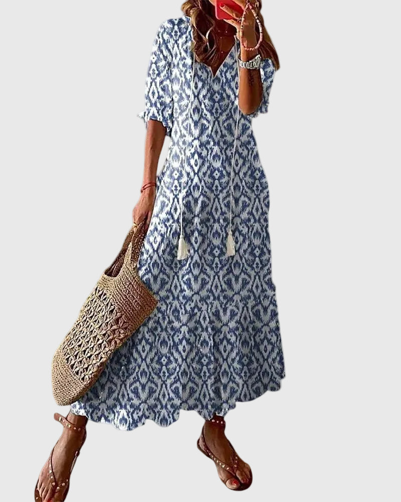Blue Amalia boho vintage summer maxi dress by THE WHITMORE FAMILY, flowing fabric with floral patterns and relaxed style.