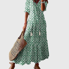 Blue Amalia boho vintage summer maxi dress by THE WHITMORE FAMILY, flowing fabric with floral patterns and relaxed fit.