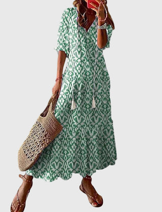 Blue Amalia boho vintage summer maxi dress by THE WHITMORE FAMILY, flowing fabric with floral patterns and relaxed fit.