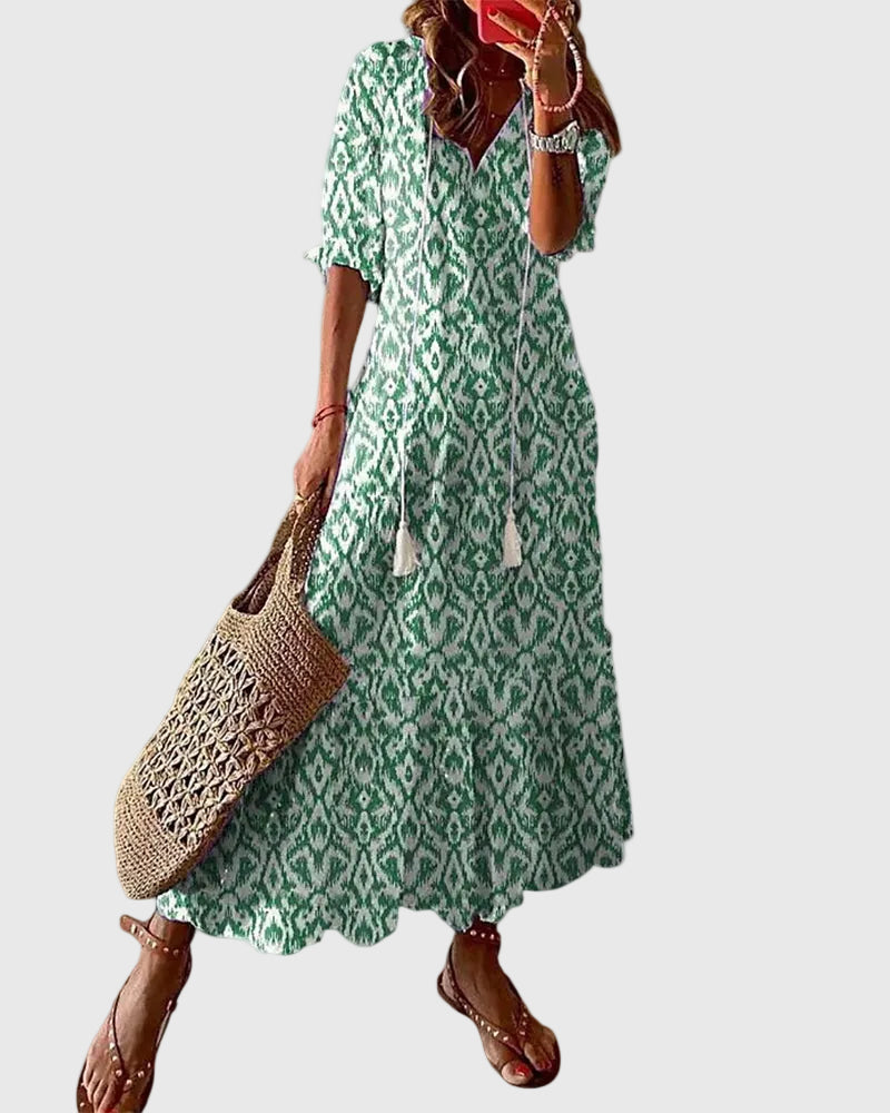 Blue Amalia boho vintage summer maxi dress by THE WHITMORE FAMILY, flowing fabric with floral patterns and relaxed fit.