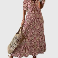 Blue Amalia boho vintage summer maxi dress by THE WHITMORE FAMILY, flowing fabric with floral patterns and relaxed fit.