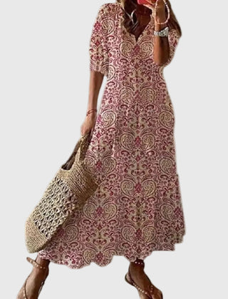 Blue Amalia boho vintage summer maxi dress by THE WHITMORE FAMILY, flowing fabric with floral patterns and relaxed fit.