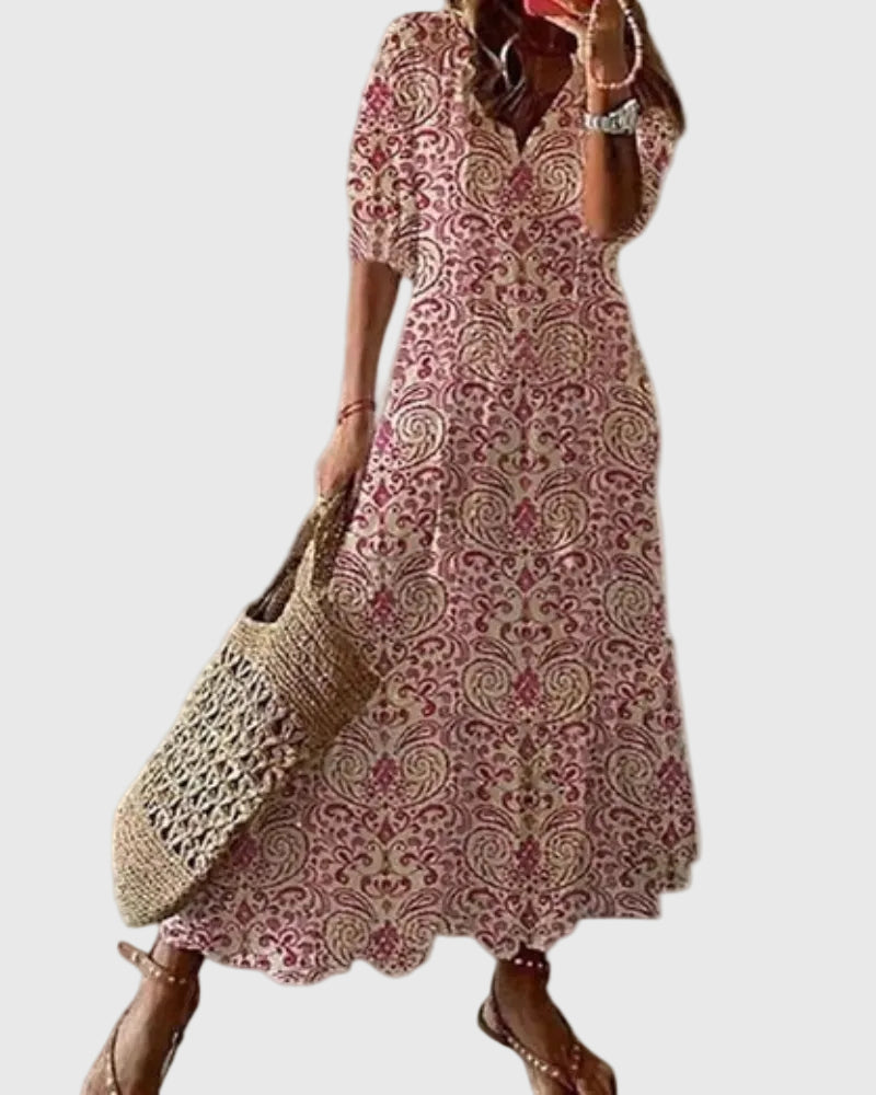 Blue Amalia boho vintage summer maxi dress by THE WHITMORE FAMILY, flowing fabric with floral patterns and relaxed fit.