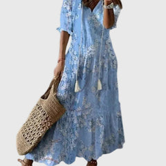 Blue Amalia boho vintage summer maxi dress by THE WHITMORE FAMILY, flowing fabric with floral pattern and relaxed fit.