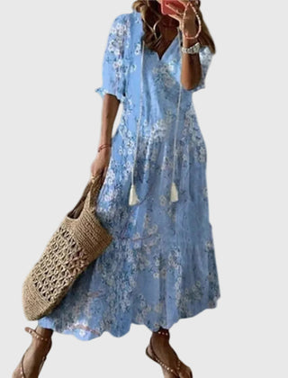 Blue Amalia boho vintage summer maxi dress by THE WHITMORE FAMILY, flowing fabric with floral pattern and relaxed fit.
