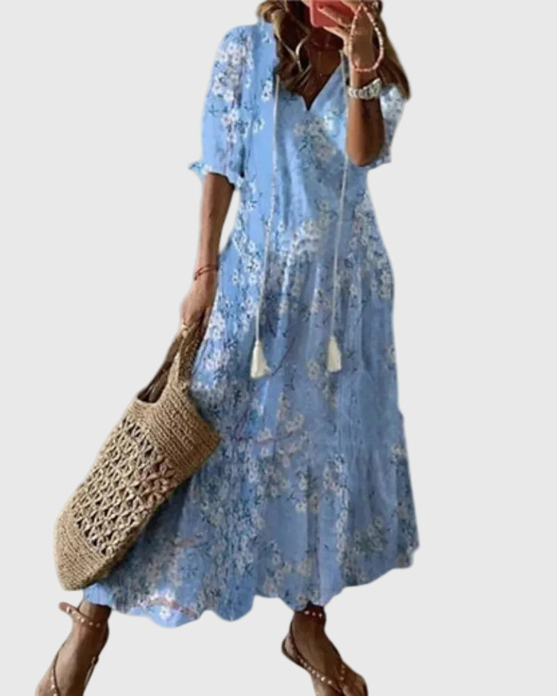Blue Amalia boho vintage summer maxi dress by THE WHITMORE FAMILY, flowing fabric with floral pattern and relaxed fit.