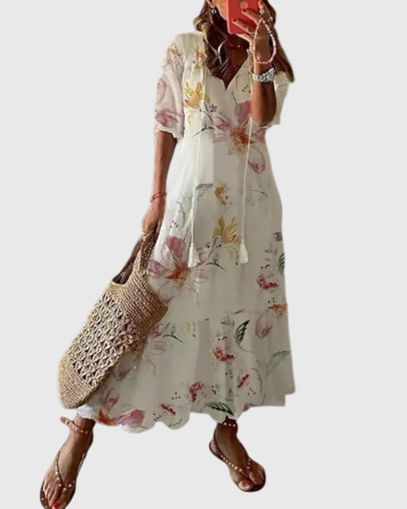 Blue boho vintage maxi dress by THE WHITMORE FAMILY, featuring flowing fabric and summer style, worn by a model outdoors.