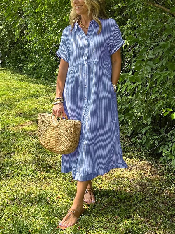 Blue Angela maxi dress by THE WHITMORE FAMILY, flowing fabric and elegant design, showcased on a model.