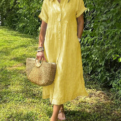 Blue Angela maxi dress by THE WHITMORE FAMILY featuring flowing fabric and a relaxed fit on a model.
