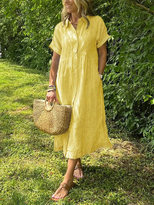 Blue Angela maxi dress by THE WHITMORE FAMILY featuring flowing fabric and a relaxed fit on a model.