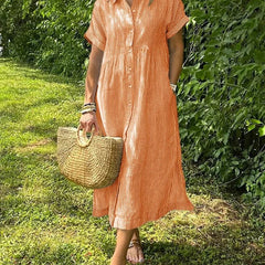 Blue Angela maxi dress by THE WHITMORE FAMILY, flowing fabric, sleeveless design, and elegant style for casual or formal wear.