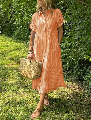 Blue Angela maxi dress by THE WHITMORE FAMILY, flowing fabric, sleeveless design, and elegant style for casual or formal wear.
