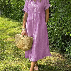 Blue Angela maxi dress by THE WHITMORE FAMILY, flowing fabric, sleeveless design, and elegant style displayed in the image.