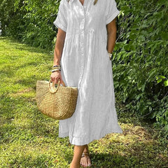 Blue Angela maxi dress by THE WHITMORE FAMILY, flowing fabric and elegant design displayed on a model.
