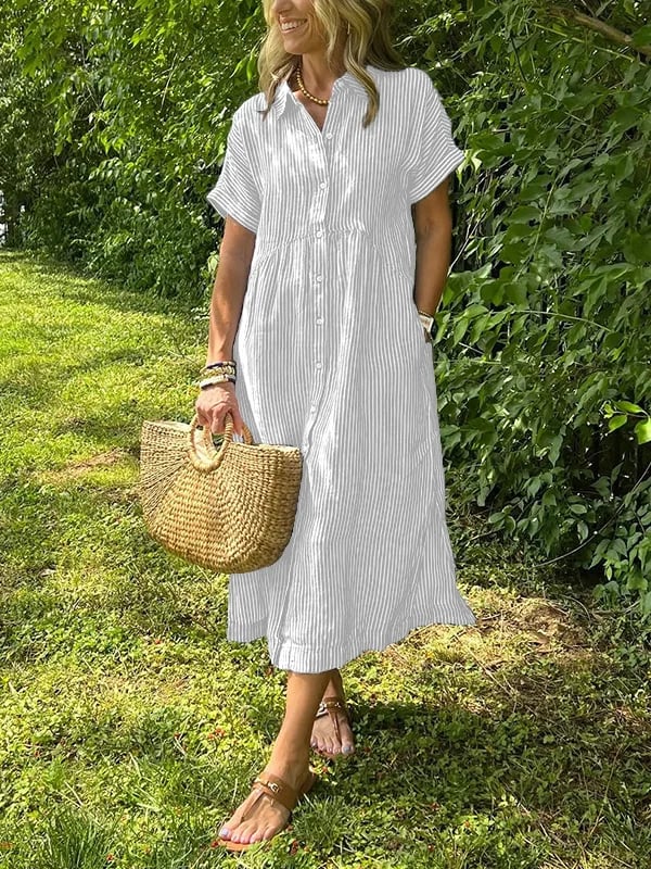 Blue Angela maxi dress by THE WHITMORE FAMILY, flowing fabric and elegant design displayed on a model.