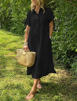 Blue Angela maxi dress by THE WHITMORE FAMILY featuring a flowing silhouette and elegant design.