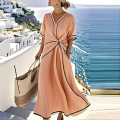 Blue Athena™ elegant flattering dress by THE WHITMORE FAMILY, shown on a model, featuring a stylish, fitted silhouette.