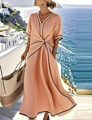 Blue Athena™ elegant flattering dress by THE WHITMORE FAMILY, shown on a model, featuring a stylish, fitted silhouette.