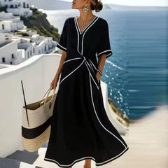 Elegant blue Athena™ flattering dress by THE WHITMORE FAMILY, featuring a stylish design and fitted silhouette.