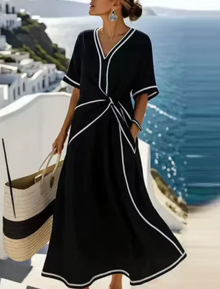 Elegant blue Athena™ flattering dress by THE WHITMORE FAMILY, featuring a stylish design and fitted silhouette.