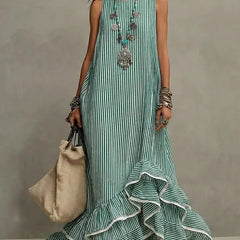 Blue Grace retro ruffled casual maxi dress by THE WHITMORE FAMILY, flowing fabric with ruffle details and a relaxed fit.