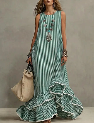 Blue Grace retro ruffled casual maxi dress by THE WHITMORE FAMILY, flowing fabric with ruffle details and a relaxed fit.