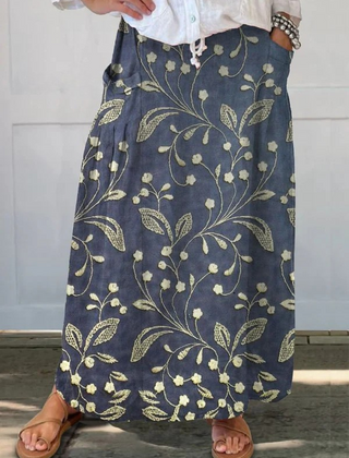 Blue Josa™ retro floral art elastic waistband pocket skirt by THE WHITMORE FAMILY, featuring a stylish vintage floral pattern and practical pockets.