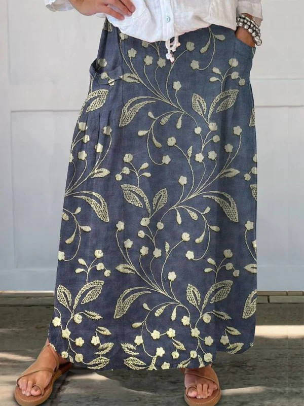 Blue Josa™ retro floral art elastic waistband pocket skirt by THE WHITMORE FAMILY, featuring a stylish vintage floral pattern and practical pockets.