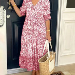 Blue Keisha floral V-neck blouse by THE WHITMORE FAMILY featuring a graceful, elegant floral design.