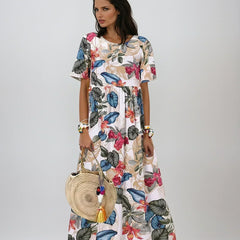 Blue Lovi Graceful Summer Bloom floral dress by THE WHITMORE FAMILY featuring a flowy design and vibrant summer-inspired pattern.