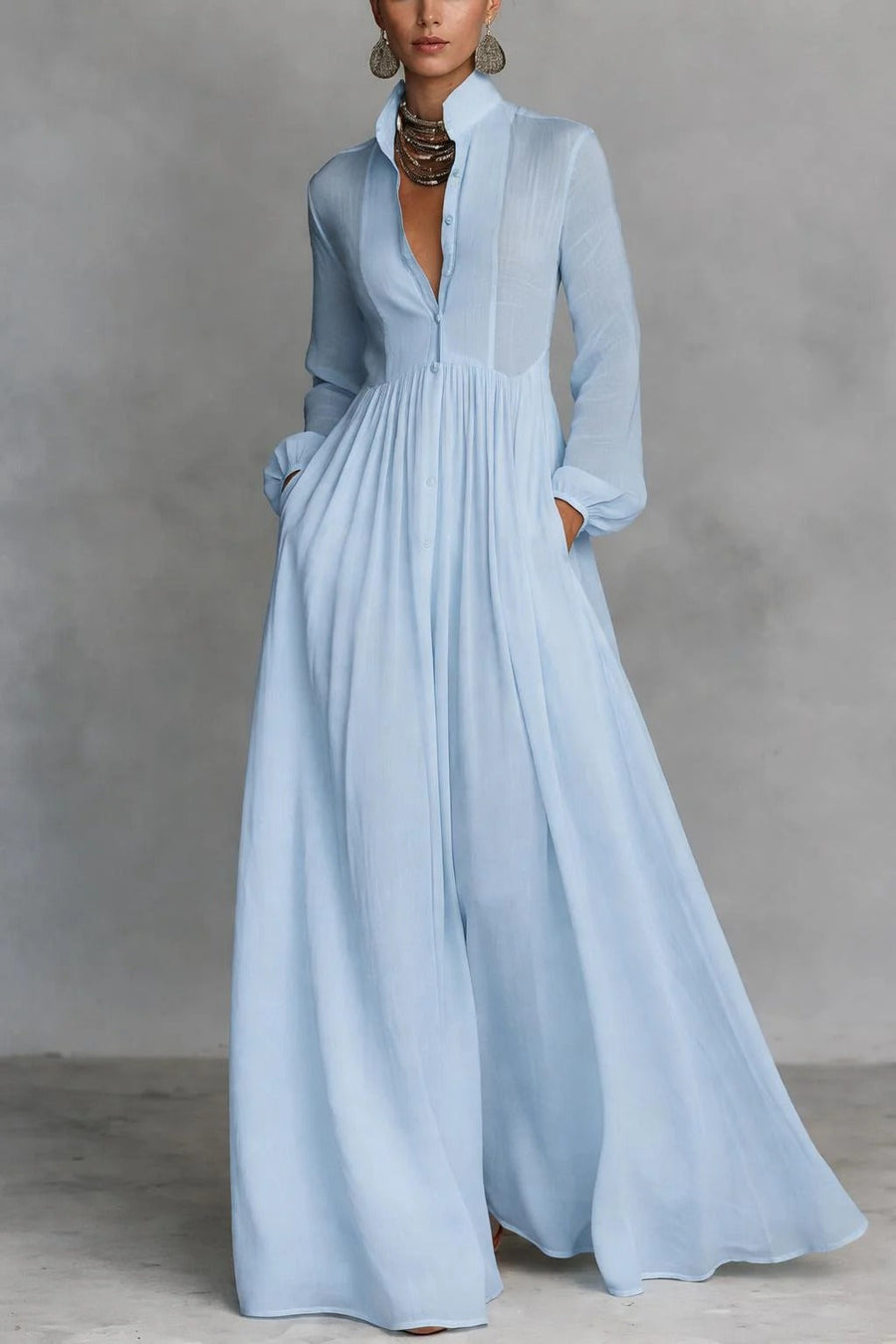 Blue Margaret maxi dress by THE WHITMORE FAMILY featuring a flowing fabric and button-front design.