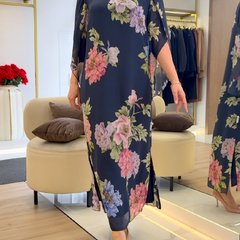 Blue Nancy floral loose maxi dress by THE WHITMORE FAMILY, flowing fabric with vibrant floral print and relaxed fit.