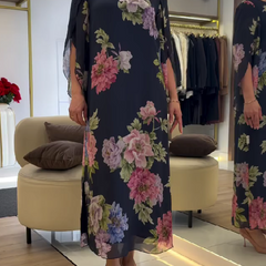 Nancy floral loose maxi dress by THE WHITMORE FAMILY, featuring blue fabric and a flowing, relaxed fit.