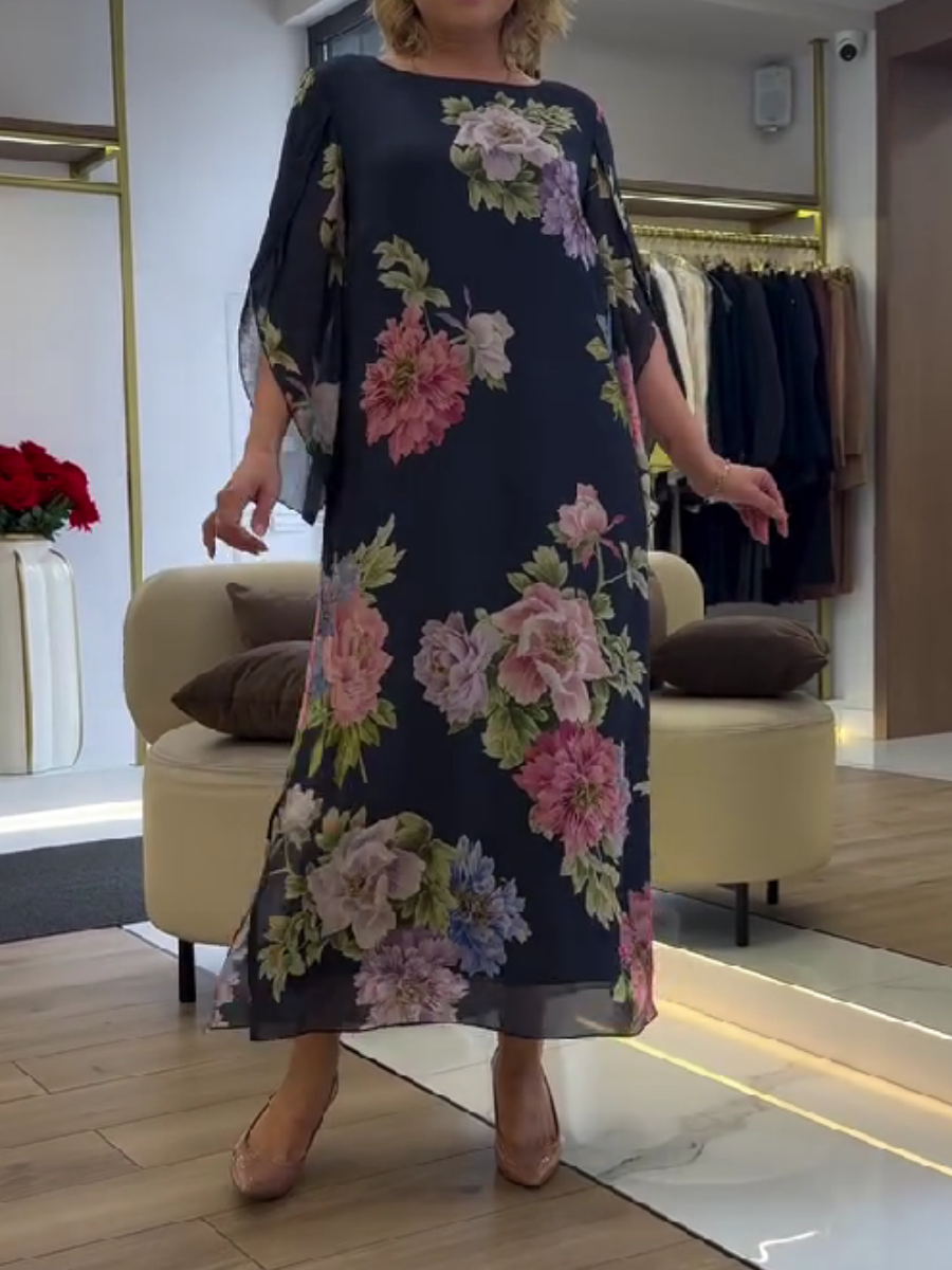 Nancy floral loose maxi dress by THE WHITMORE FAMILY, blue with a flowing, relaxed fit and floral pattern.
