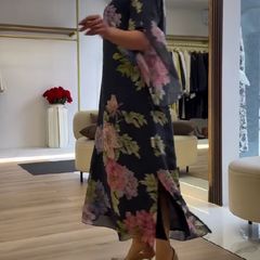 Blue Nancy floral loose maxi dress by THE WHITMORE FAMILY featuring a flowy silhouette and vibrant floral pattern.