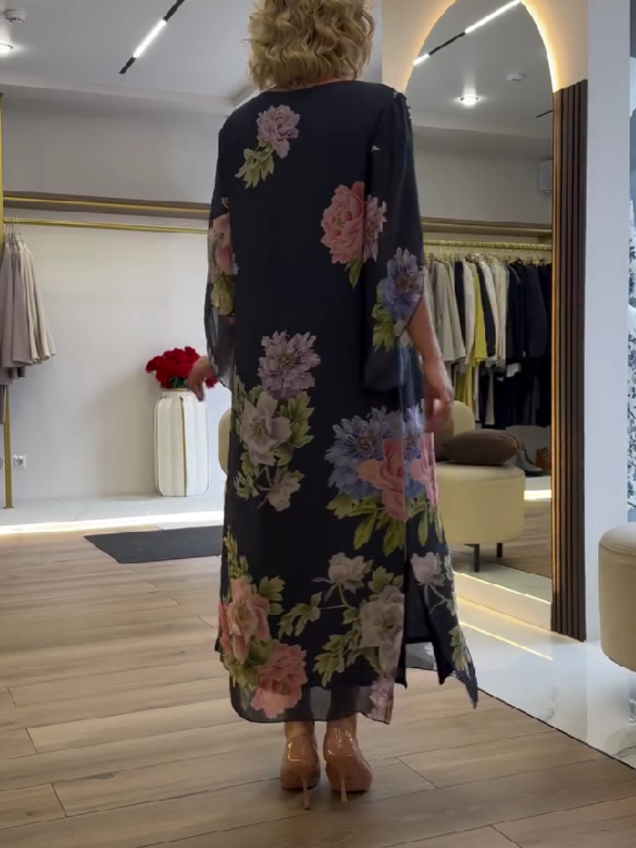 Nancy floral loose maxi dress by THE WHITMORE FAMILY, featuring a blue fabric with a flowing, relaxed fit and floral pattern.