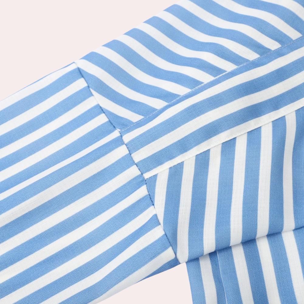 Noa relaxed striped shirt midi dress by THE WHITMORE FAMILY, featuring blue and white horizontal stripes and a casual fit.