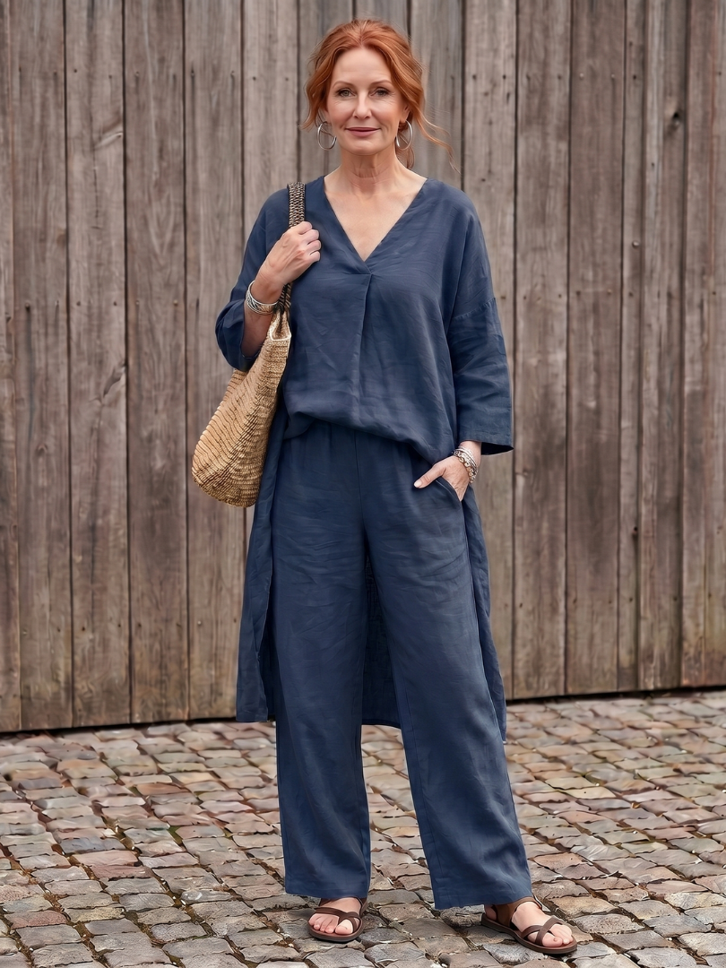 Blue loose tunic top and wide-leg pant set by THE WHITMORE FAMILY, styled for a relaxed, elegant look.