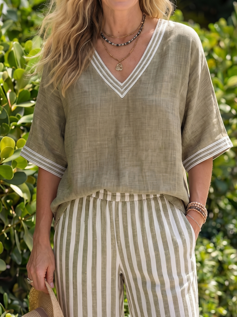 Blue Wren contrast V-neck tunic and stripe trouser set by THE WHITMORE FAMILY, shown on a model.
