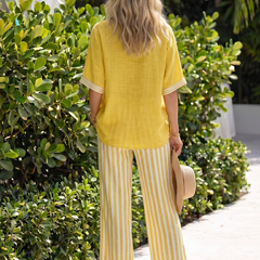 Blue Wren contrast V-neck tunic and stripe trouser set by THE WHITMORE FAMILY, featuring stylish, coordinated casual outfit.