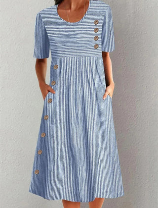Blue Sofia striped summer dress by THE WHITMORE FAMILY, sleeveless with a fitted bodice and flowing skirt, perfect for warm weather.