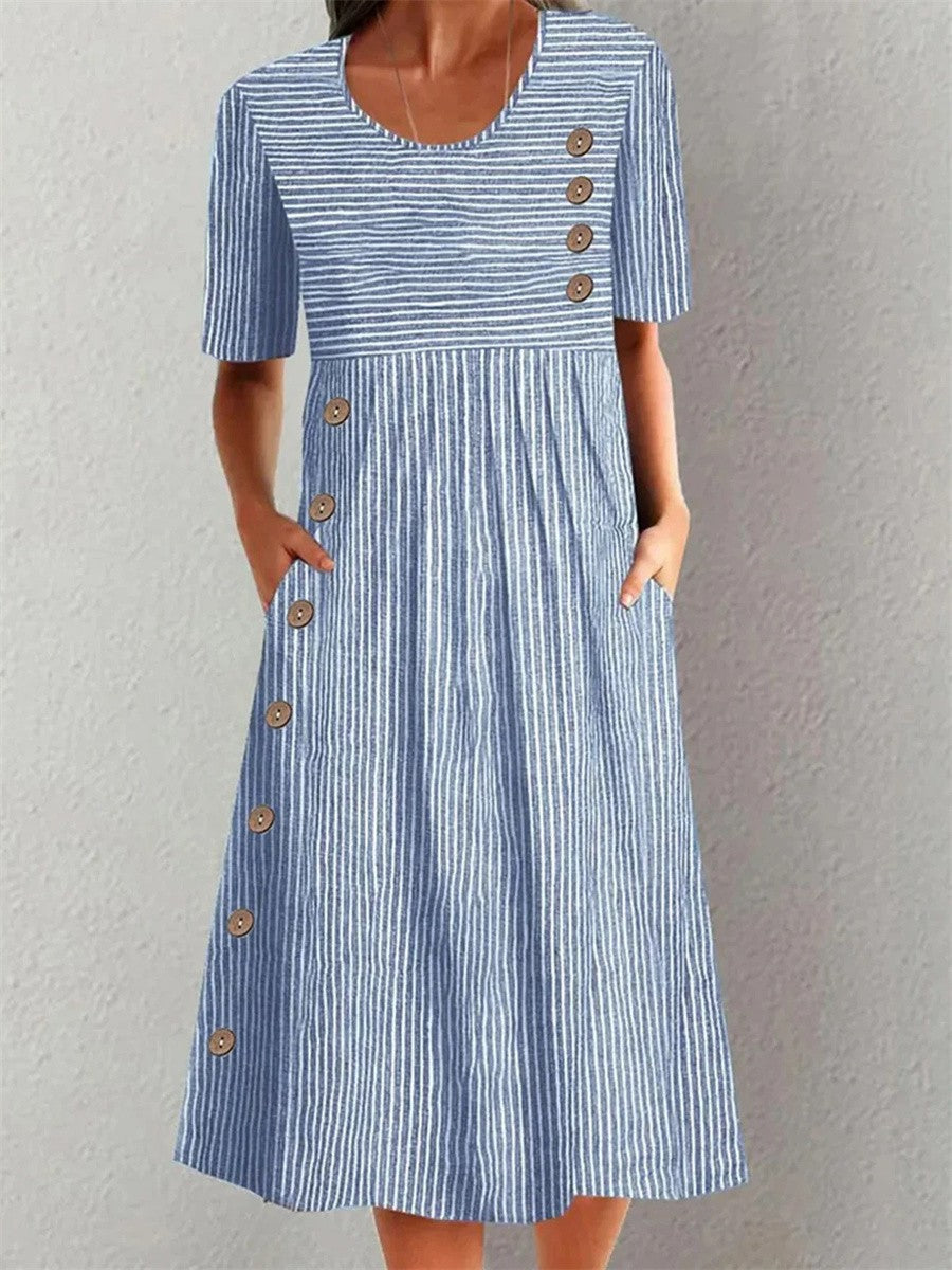 Blue Sofia striped summer dress by THE WHITMORE FAMILY, sleeveless with a fitted bodice and flowing skirt, perfect for warm weather.