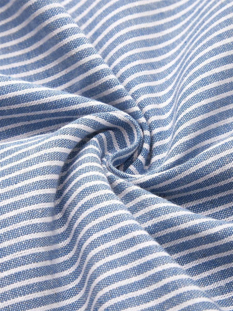Blue Sofia™ striped summer dress by THE WHITMORE FAMILY, shown on a model with a fitted bodice and flowing skirt.