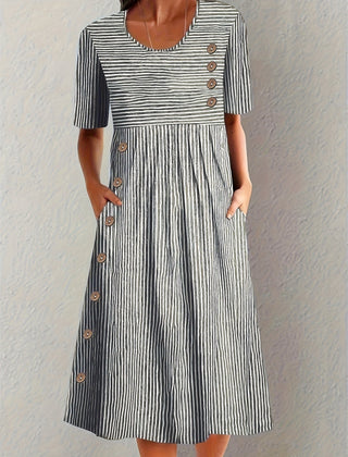 Blue Sofia™ striped summer dress by THE WHITMORE FAMILY, featuring a casual fit and vibrant pattern for warm weather wear.