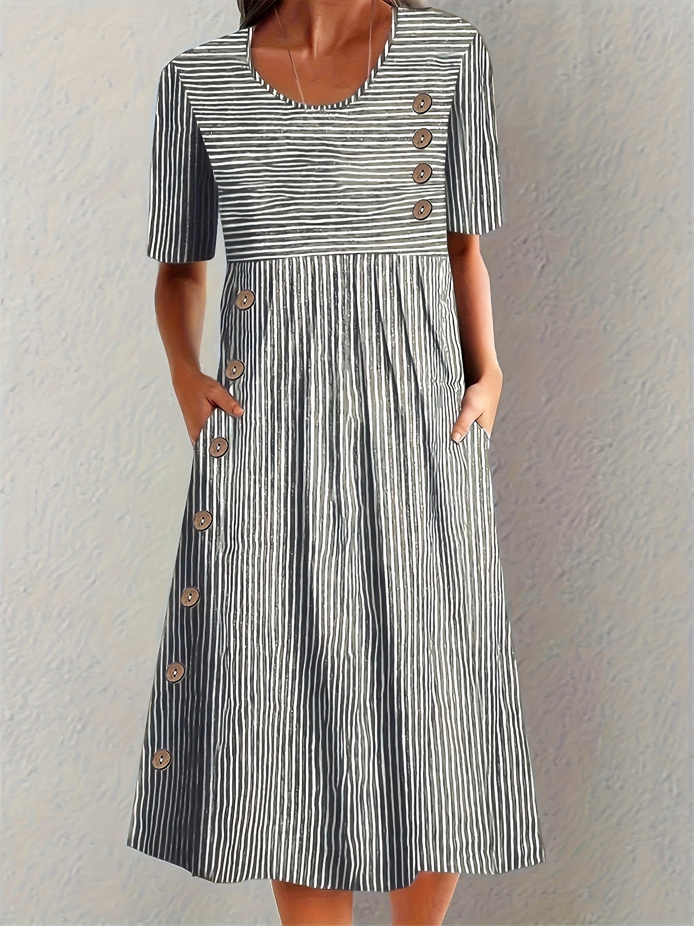Blue Sofia™ striped summer dress by THE WHITMORE FAMILY, featuring a casual fit and vibrant pattern for warm weather wear.