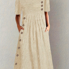 Blue Sofia™ striped summer dress by THE WHITMORE FAMILY, featuring a sleeveless design and casual fit for warm weather.